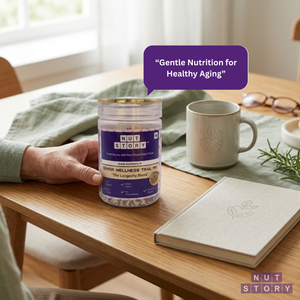 Person holding a Nut Story Senior Wellness Trail Mix jar at a table with a cup and notebook.