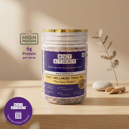 Jar of NutStory Daily Wellness Trail Mix with visible label on a cream background