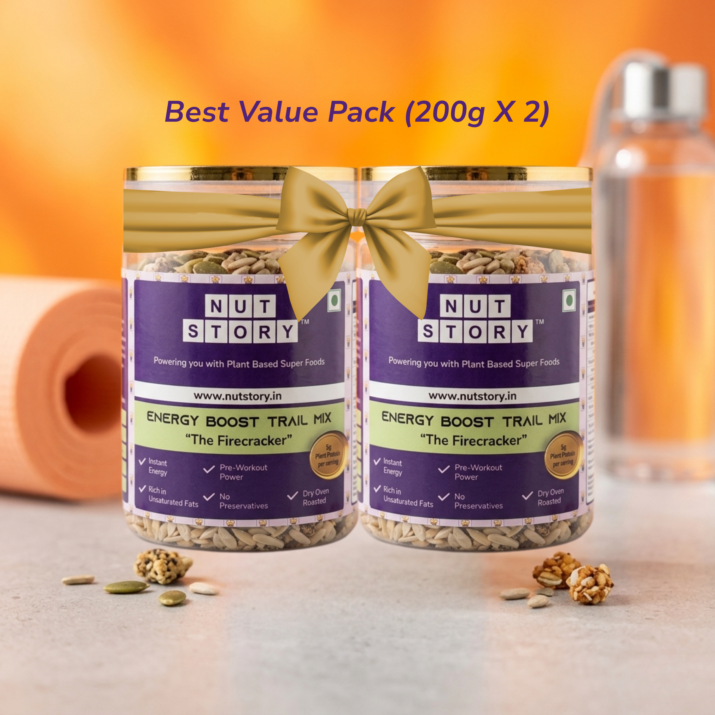 Two jars of Nut Story energy boost trail mix with a bottle in the background.