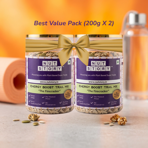 Two jars of Nut Story energy boost trail mix with a bottle in the background.