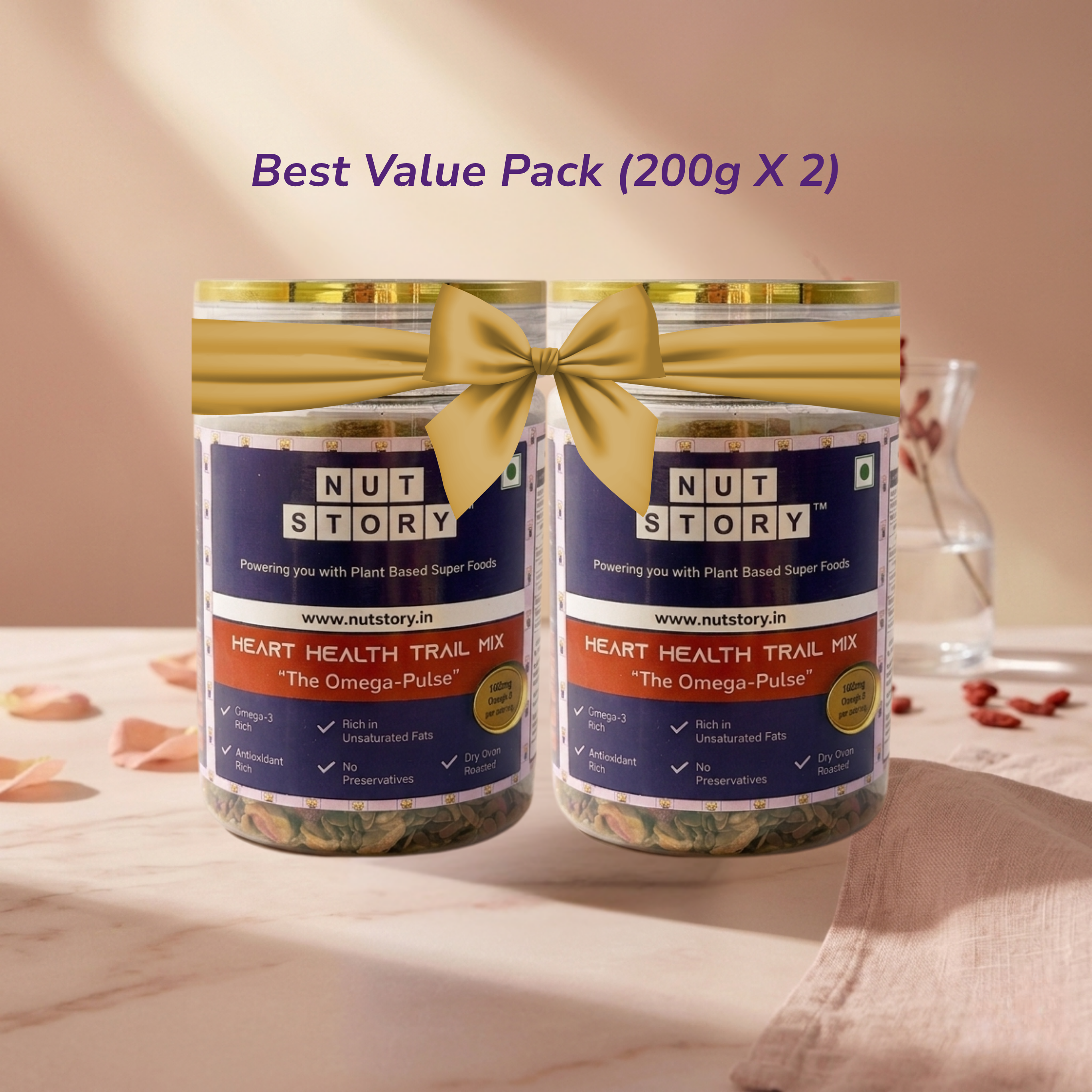 Two jars of Nut Story heart health trail mix with a gold bow on a beige background